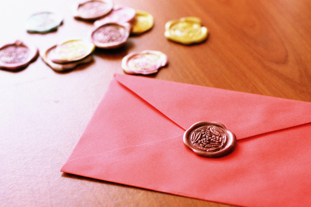 Envelope with decorative wax seal, artfully photographed