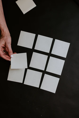 hand moving blank post-it cards